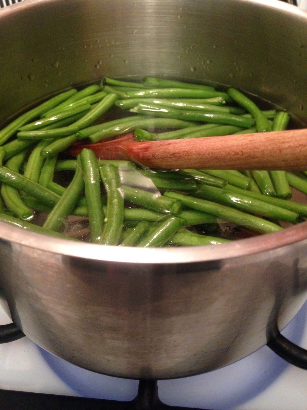 Trim and discard the ends of the beans - add them to boiling water 3-5 min- drain thoroughly and rinse with cold water to stop the cooking process