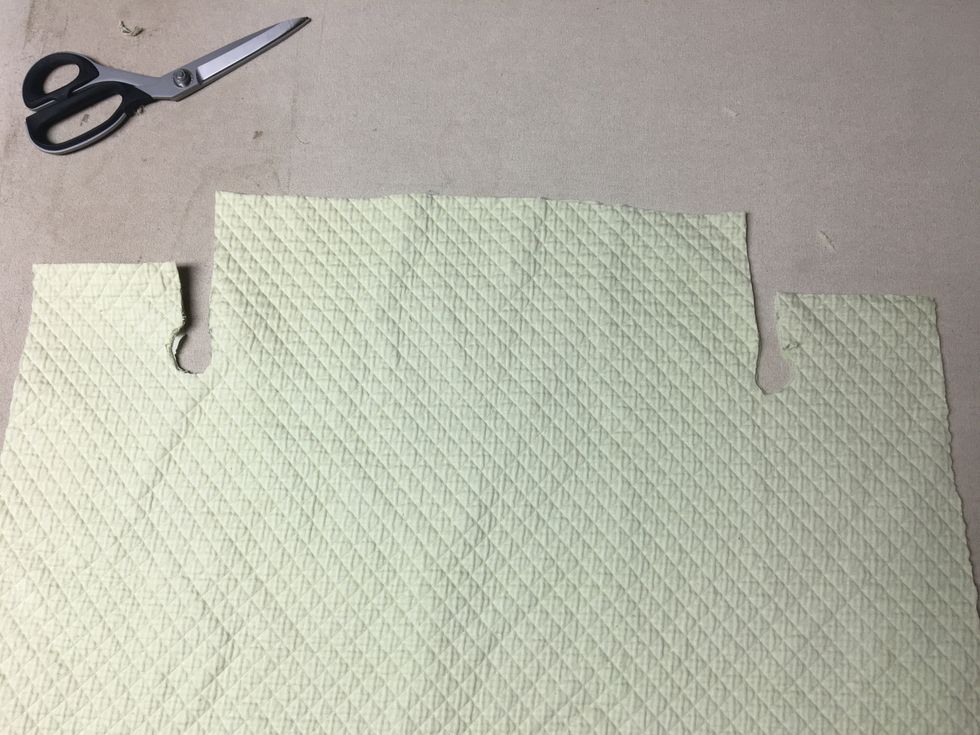 Trim away slowly and a little at a time.  Fit it on your chair again.  Trim too much and it's ruined.