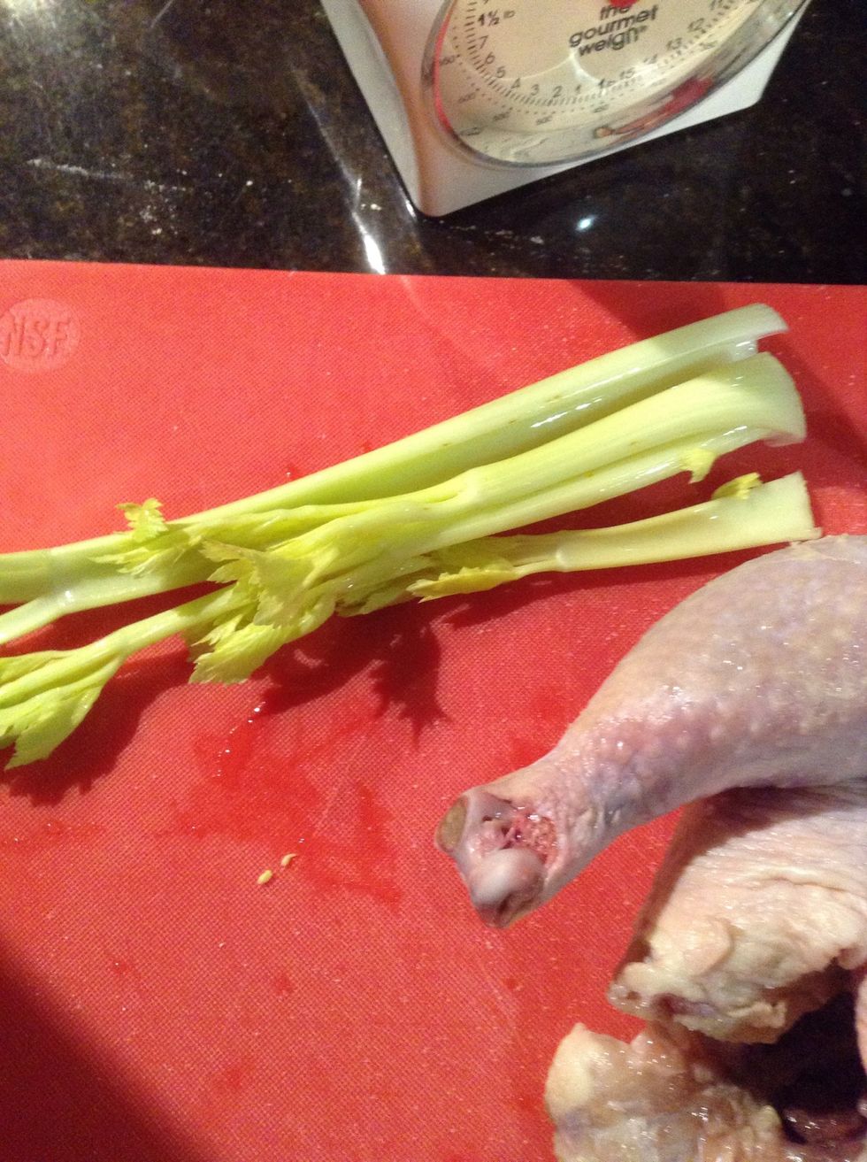 Trim celery heart and leek so when put in chicken it all still fits in pot. Add 2 cups of stock, wine (1 c.) and the chicken cover and cook in oven at 375F for 1 hour.