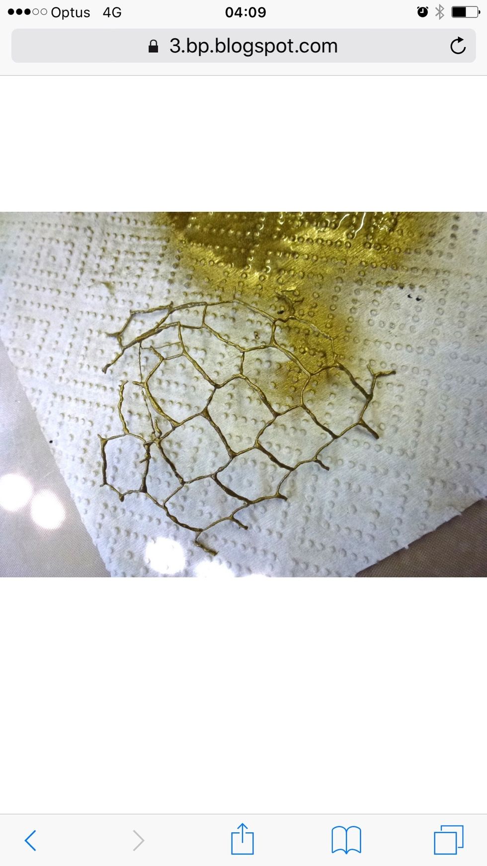 Trim chicken wire to rough heart shape using wire cutters and then spray with gold spray paint.