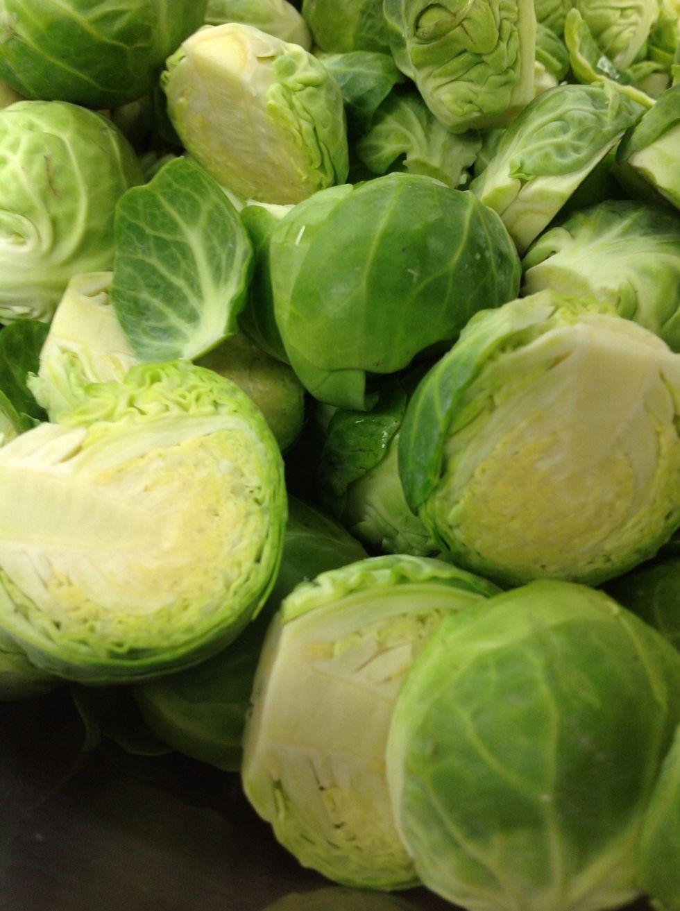 Trim ends off and cut in half