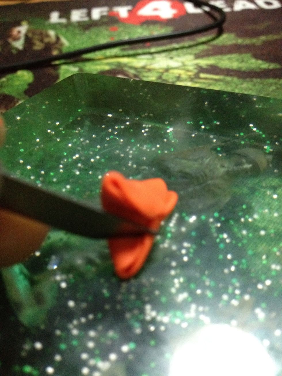 Trim off excess coloured clay and set aside to create more of the same coloured M&Ms :D