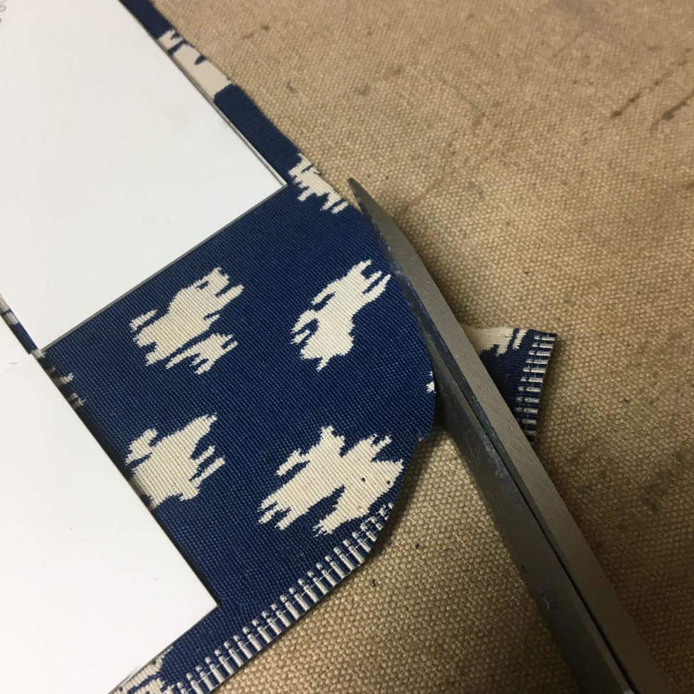 Trim off the corners so that they are rounded.