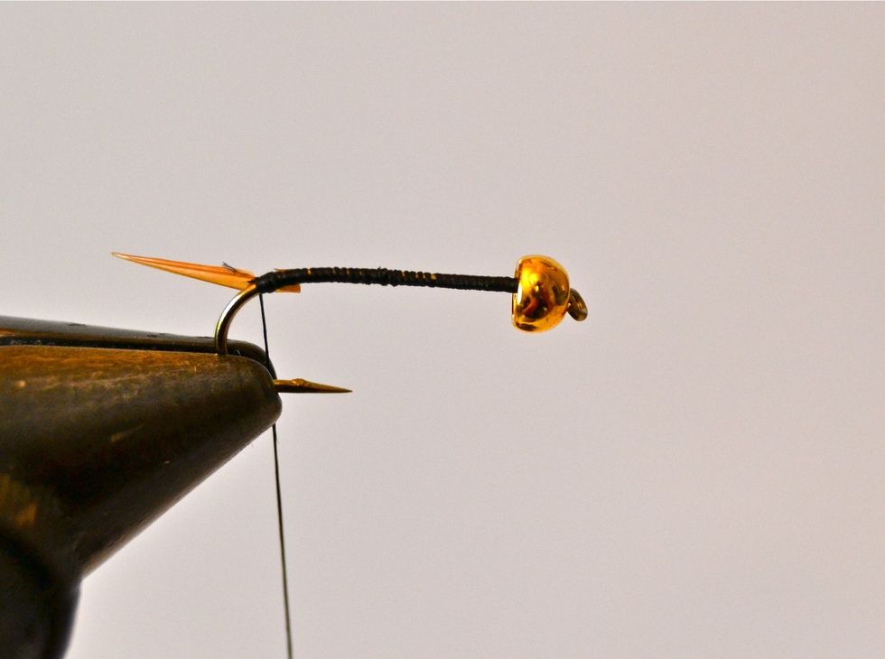 Trim off the excess biot barb and make a couple more wraps to snug the biot barb in place.