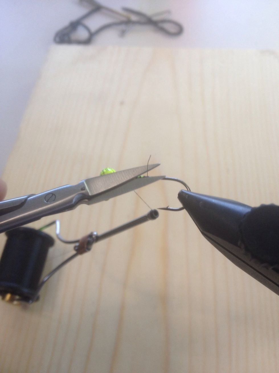 Trim off the excess if you have any. Don't cut the thread in the bobbin though. It stays the whole process.