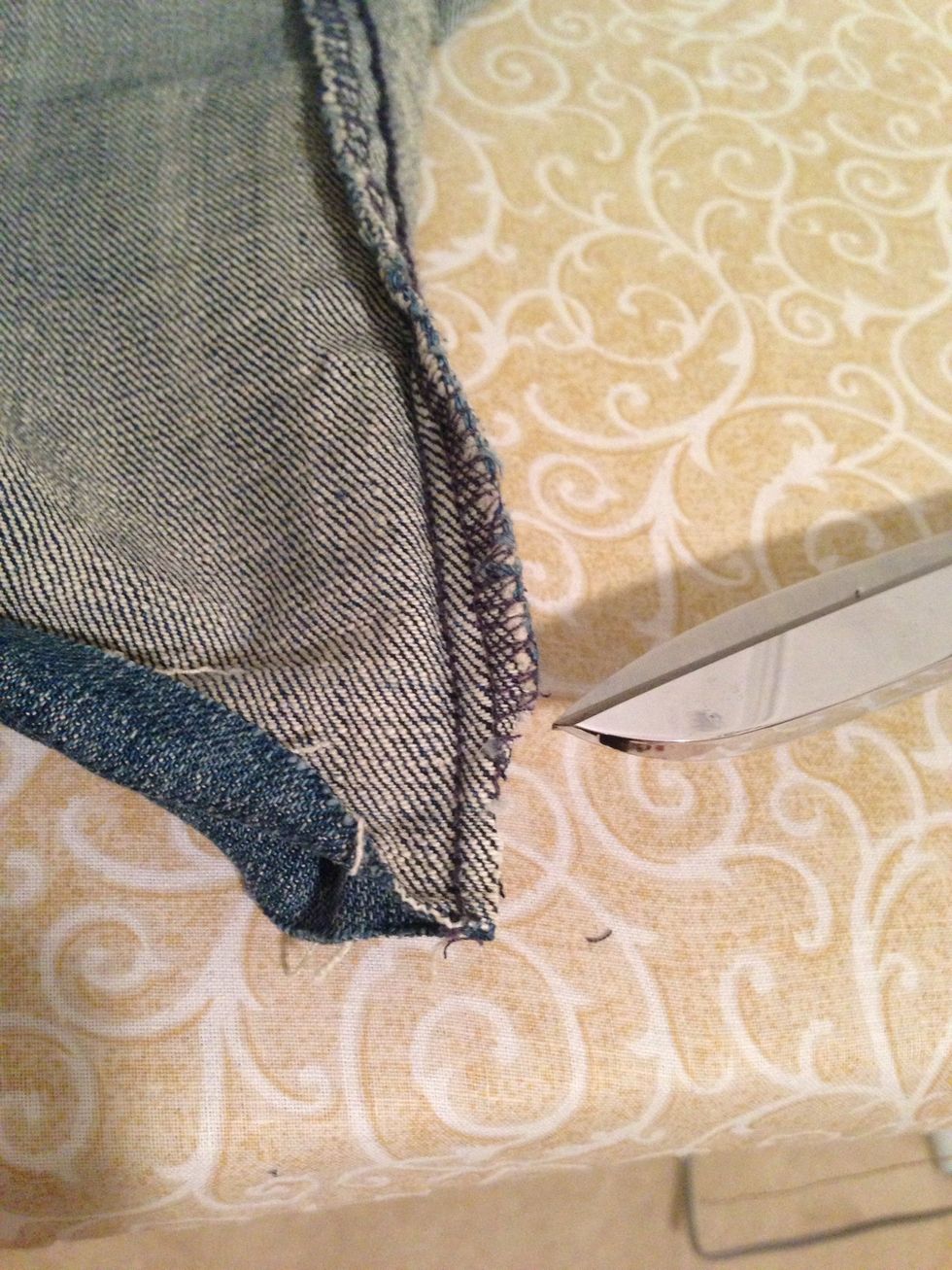 Trim off the little corner(s) of seam 1/2 way before ironed fold to reduce thickness for sewing. Be careful to leave inner seam alone.