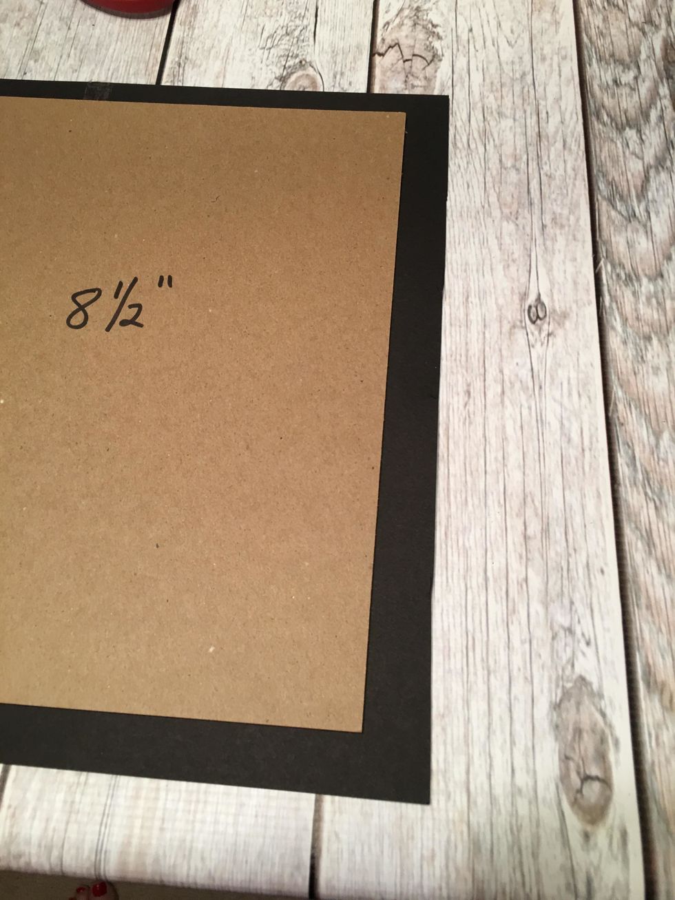 Trim off the right edge of the card stock so you have about 3/4" -1" of paper extending.  You will have at least 3/4" of paper on all four edges to wrap your cover.