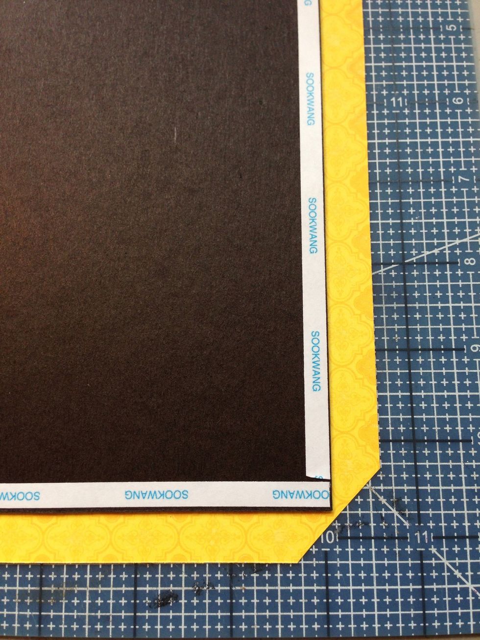 Trim paper at corners as shown.