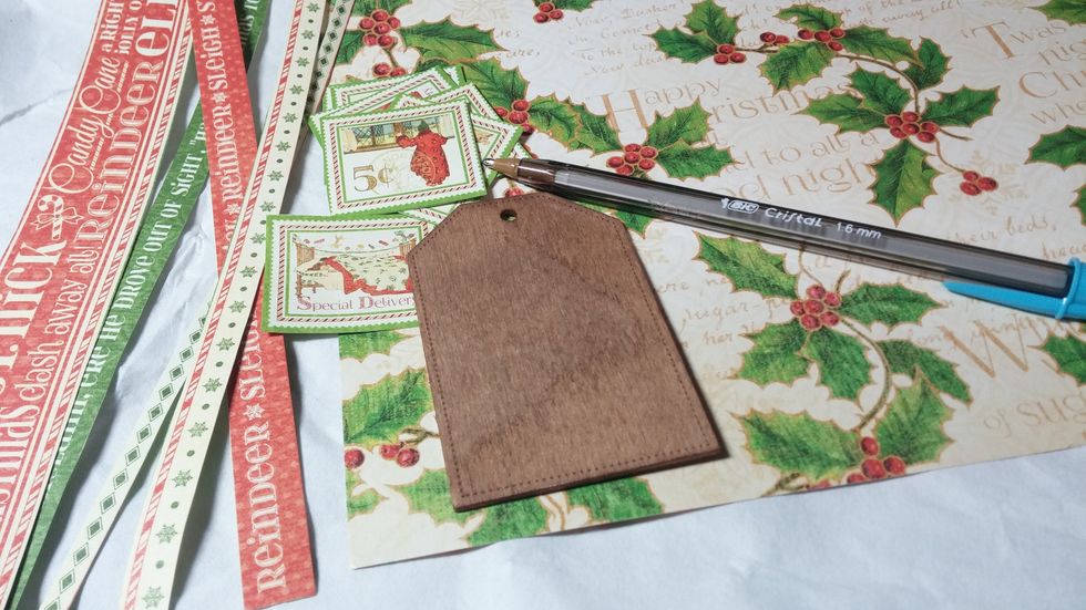 Trim some cut aparts from the Graphic 45 paper for embellishing. Cut a template for the tag.  I made mine slightly smaller as I wanted to preserve the dotted detail on the tag's edge.