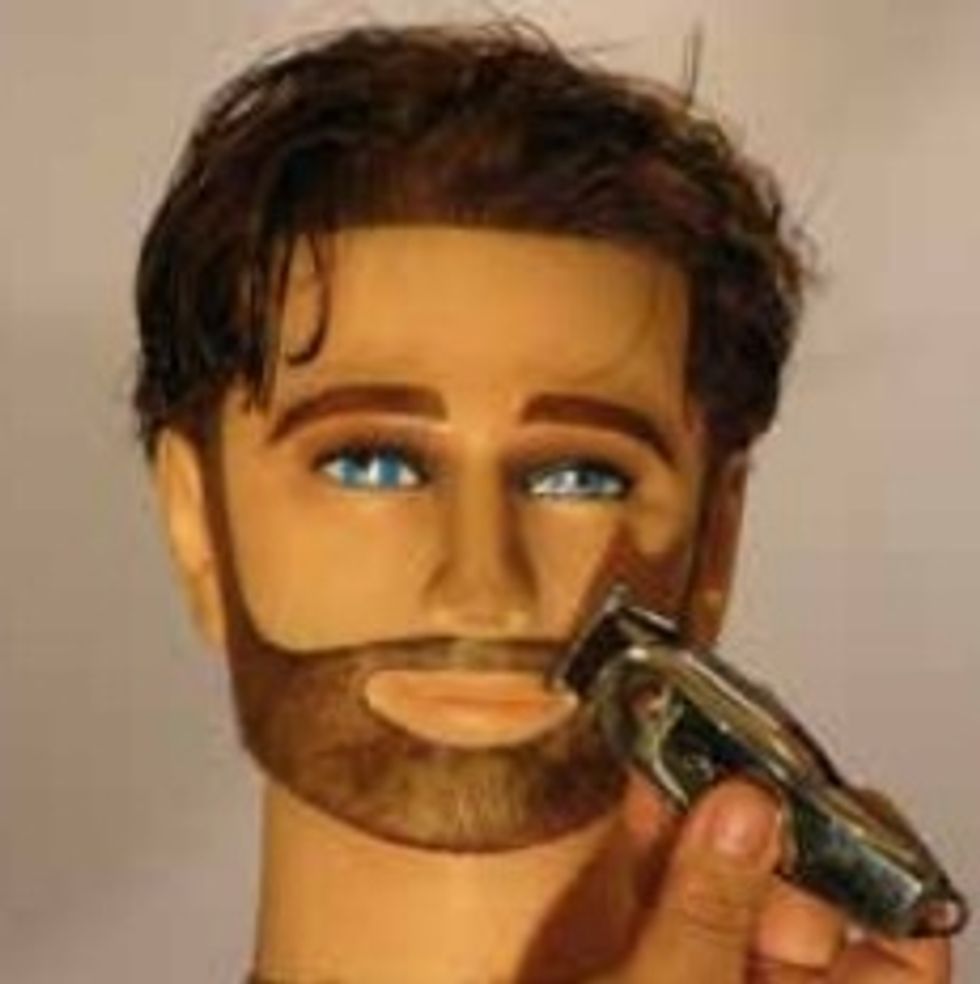 Trim the beard down to about 1/8" and trim all the excess hair from the face.