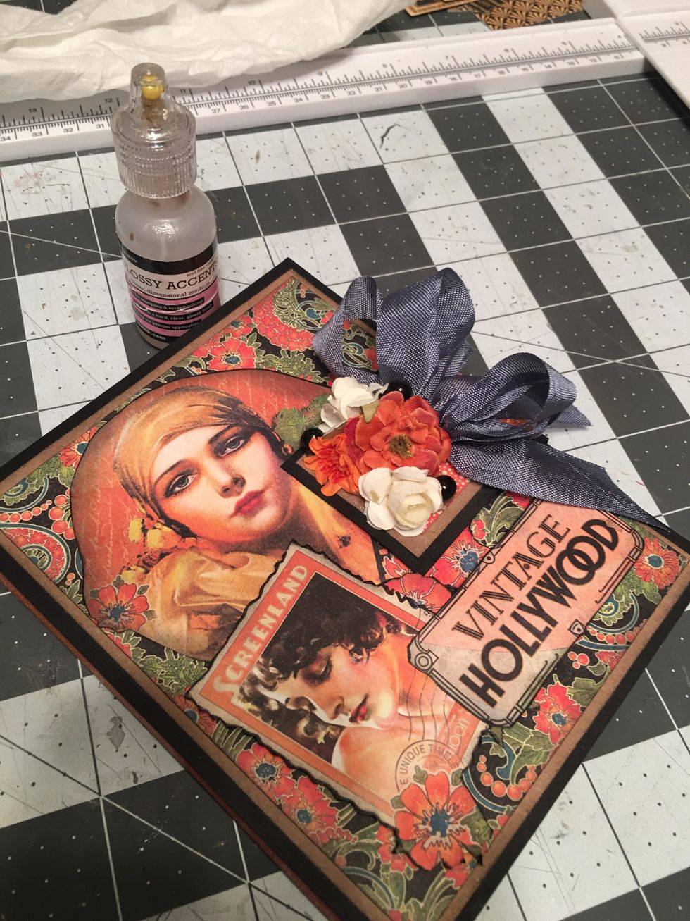 Trim the ends of the bow as needed. Use Glossy Accents and attach 3 pearls in among the flowers. Allow to dry.