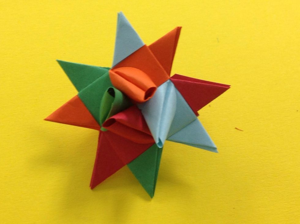 Trim the excess strip off next to the point of the star.