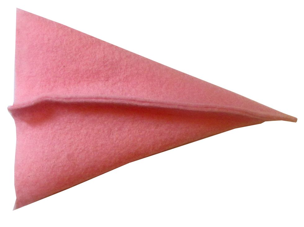 Trim the flap to form a straight edge at the top of the "cone."