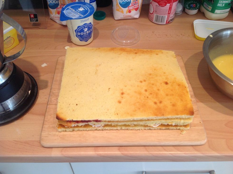 Trim the lemon sponge and place on top, return to the fridge