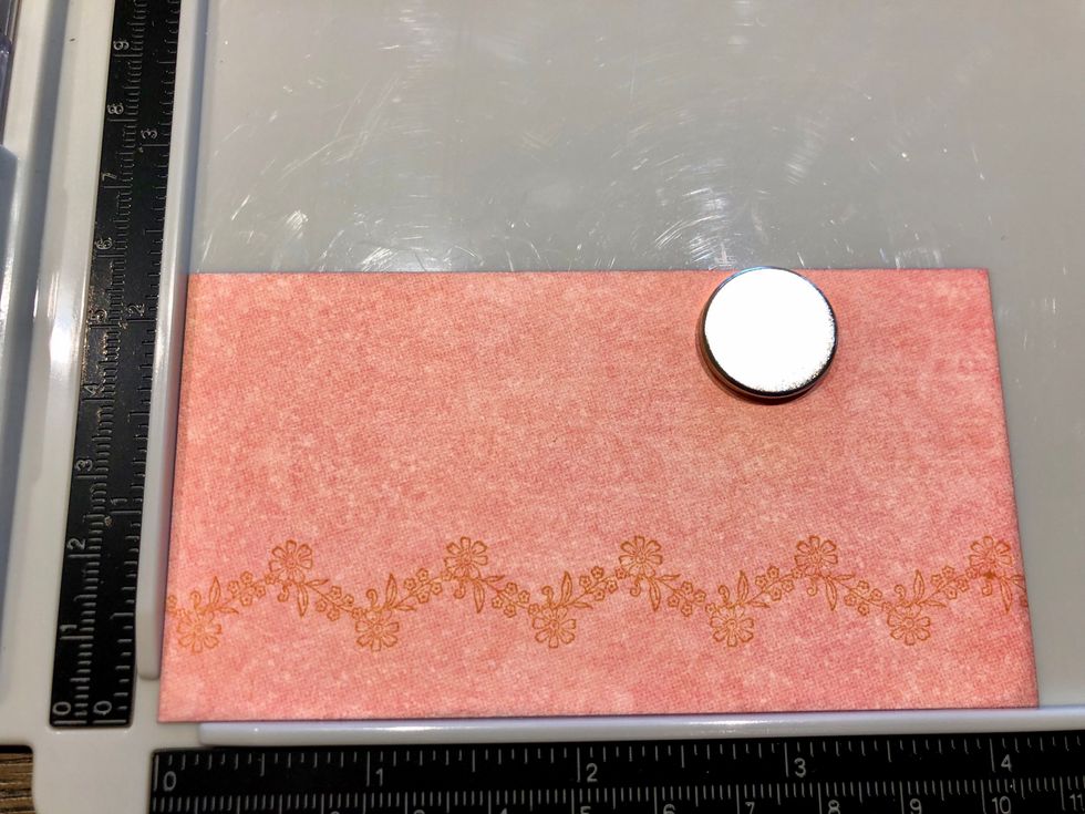 Trim the pink solid image to measure 1/4 inch smaller than the inside of your invitation. Stamp the same border along the bottom edge using the Decades Venetian Lace Ink. Stamp multiple times.