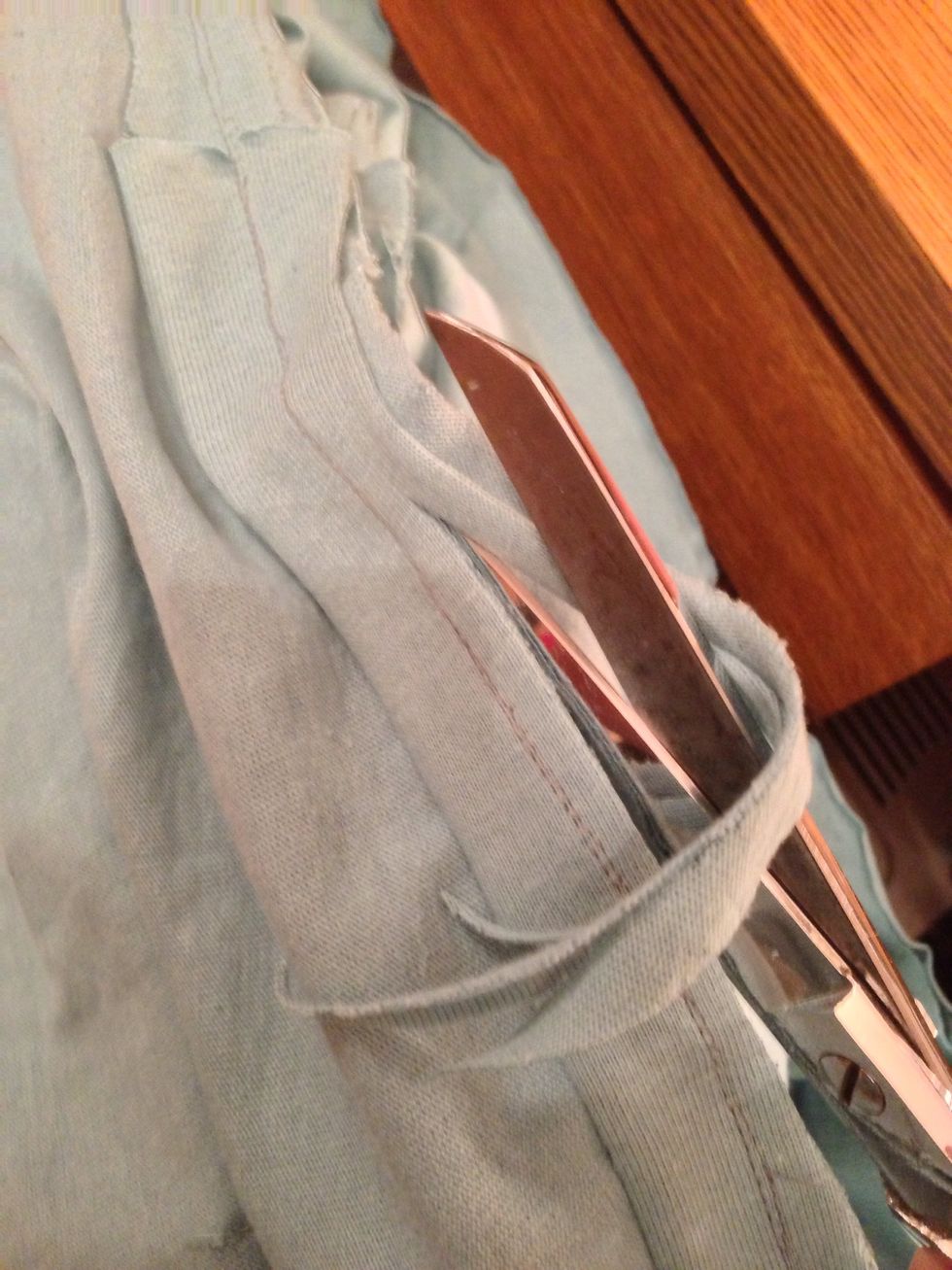 Trim the seam, then trim excess width on the other side of the 1" strip.