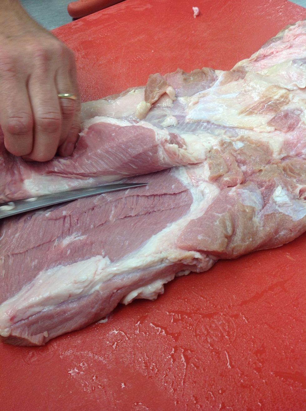 Trim veal breast and butterfly thick parts
