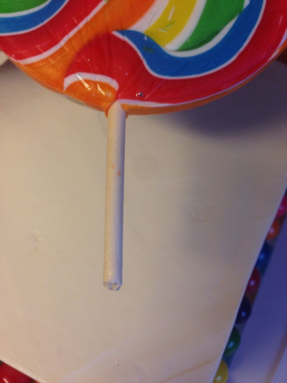 Trim your jumbo lollipop sticks. I cut mine to the point where the wrapper ended. I didn't want any germs in my cake. Lol