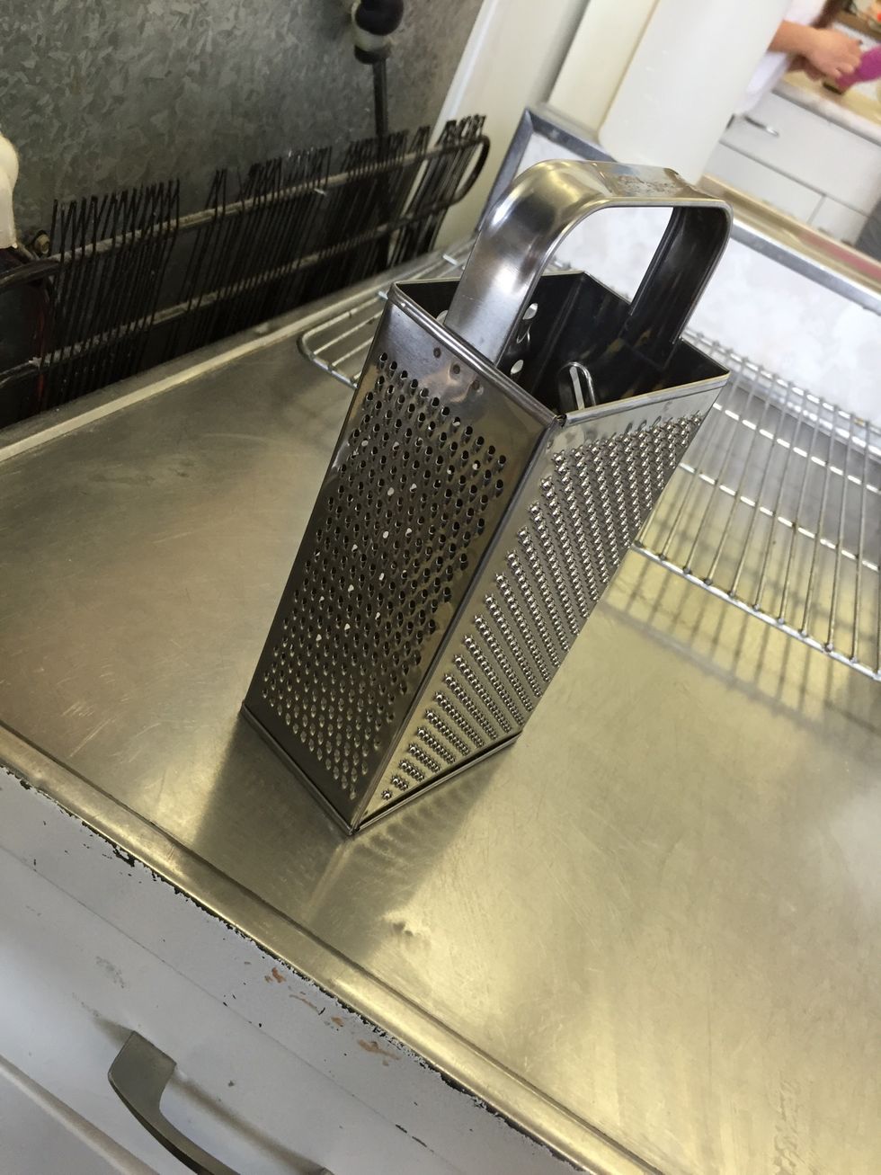 Tris is a grater it is used for grating cheese and other foods. I can grate cheese.