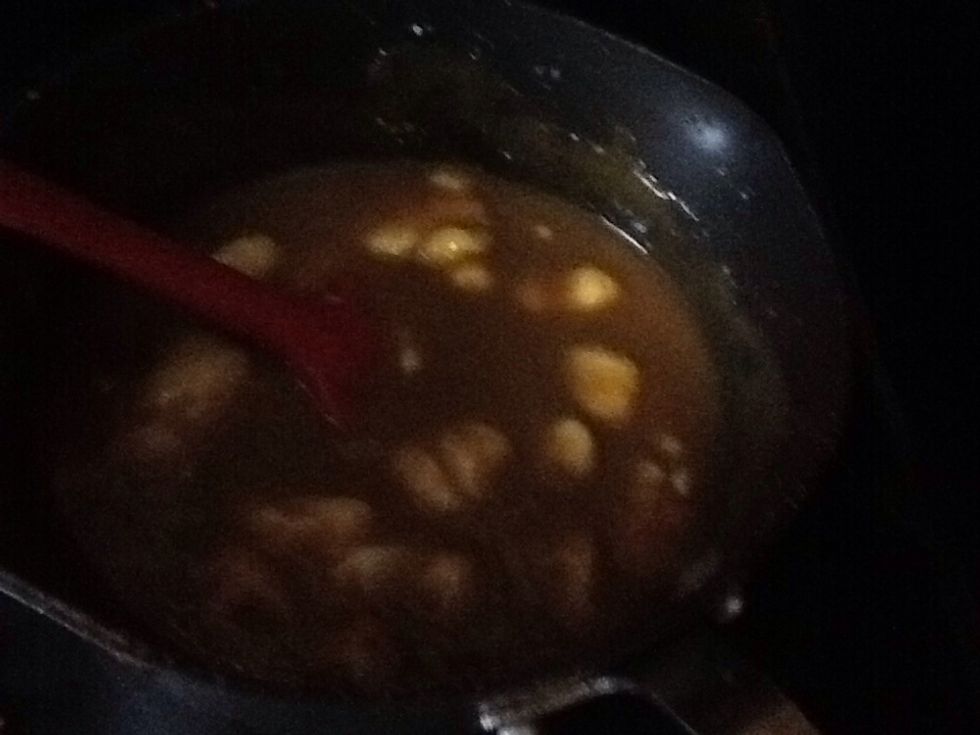 Try and mix the most before it's on the heat. Stirred sugar has a hard time coming to a boil. Once butter is melted (about 5-7 mins) watch for bubbles around outside of pot.