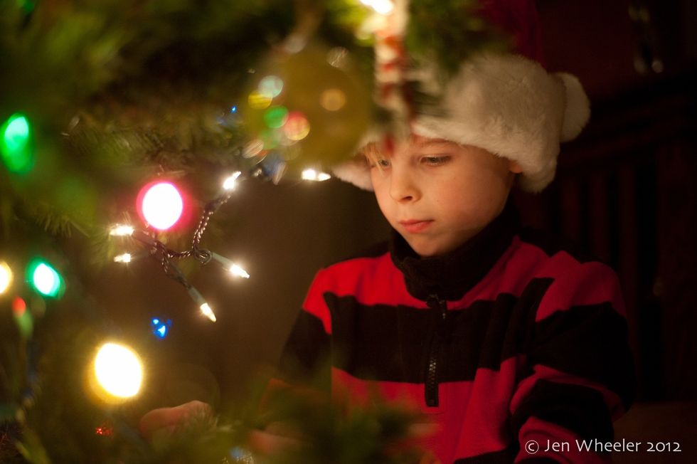 Try framing your child with the activity at hand. Here, I got right in between the branches. Spot meter on the face.