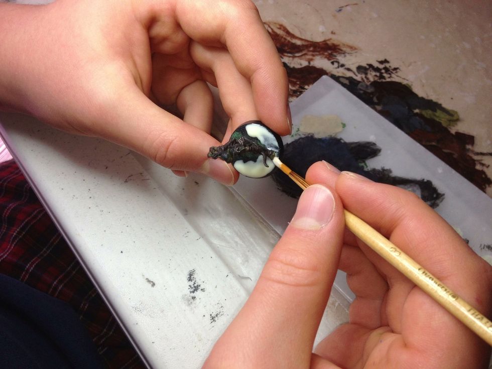 Try not to get any on the miniature. When you apply the sand it will stick to anywhere the glue has been applied.