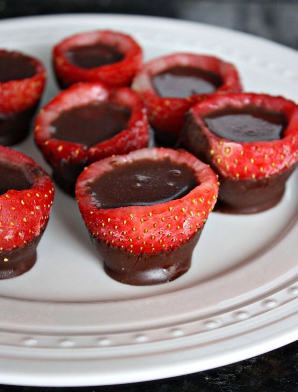 Try to choose strawberries as big as you can find. Cut the point of the strawberry off so they can stand on their own, the melted chocolate helps form a little base which makes them even more stable