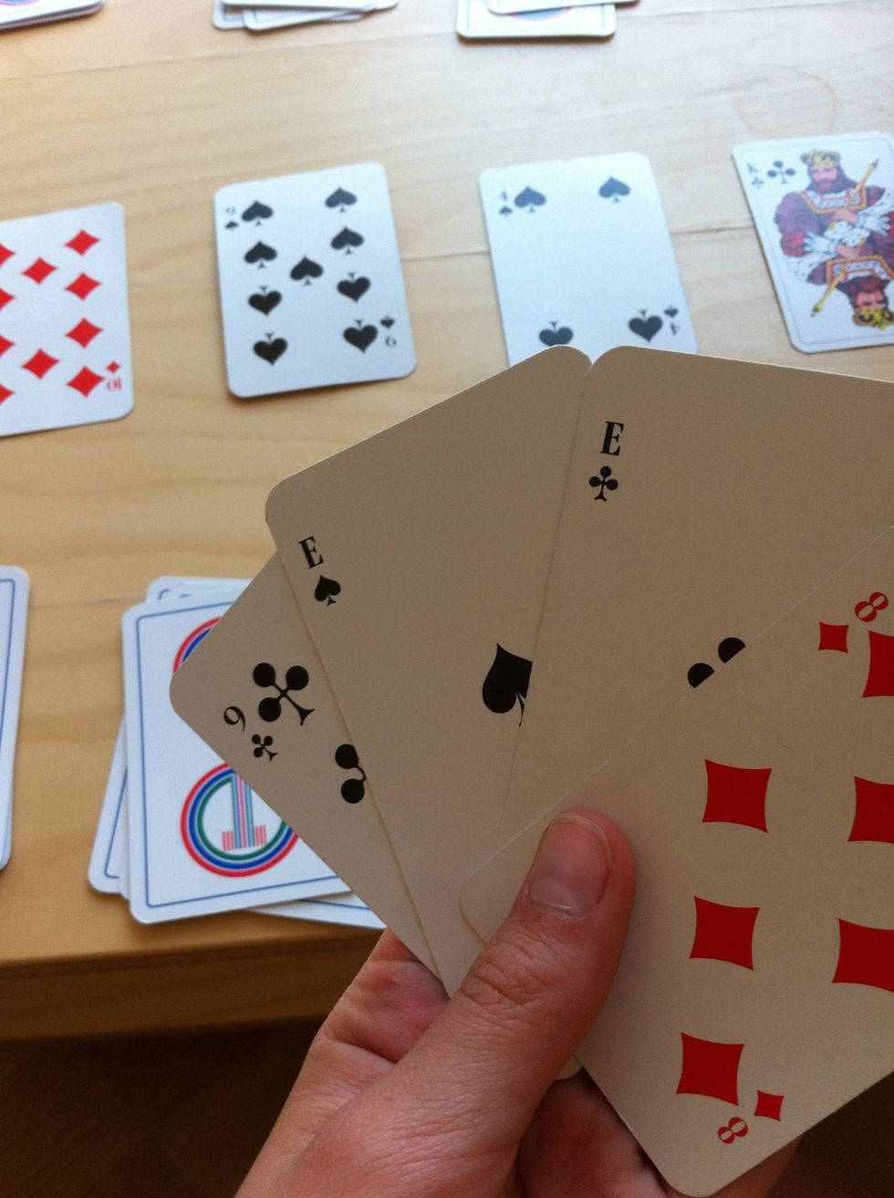 Try to find something you have more then one of. In this case, I have two A's. Then see if any of them are in the middle four cards.