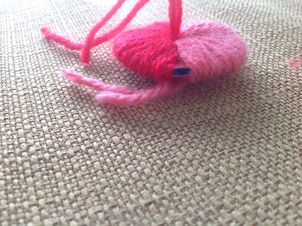 Try to find the space between the two circles (hoop) you made earlier.