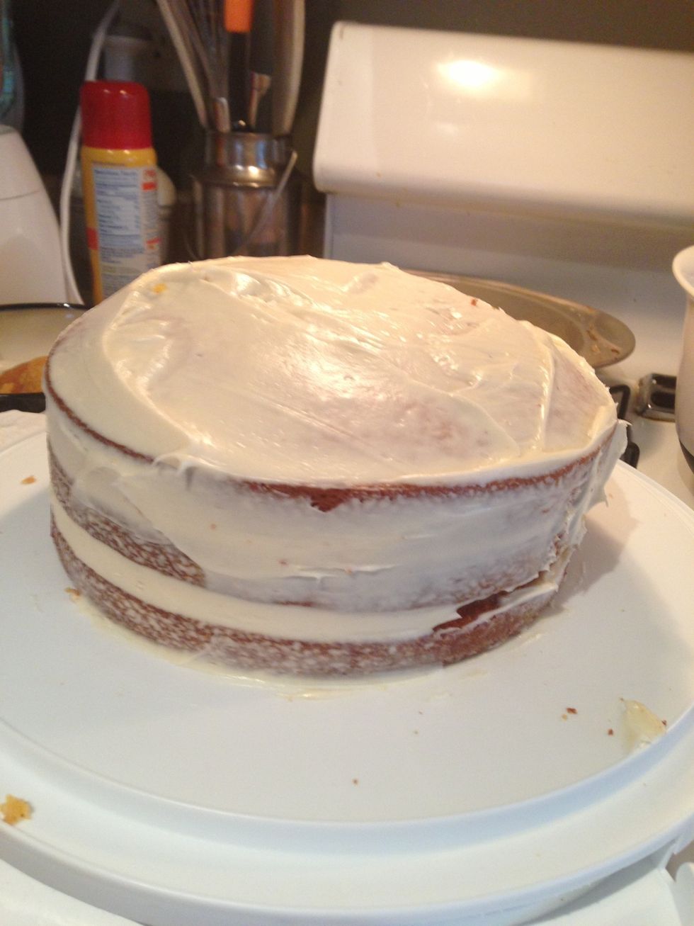 Try to get your sides covered first, before you just smooth the top of the cake with the frosting.