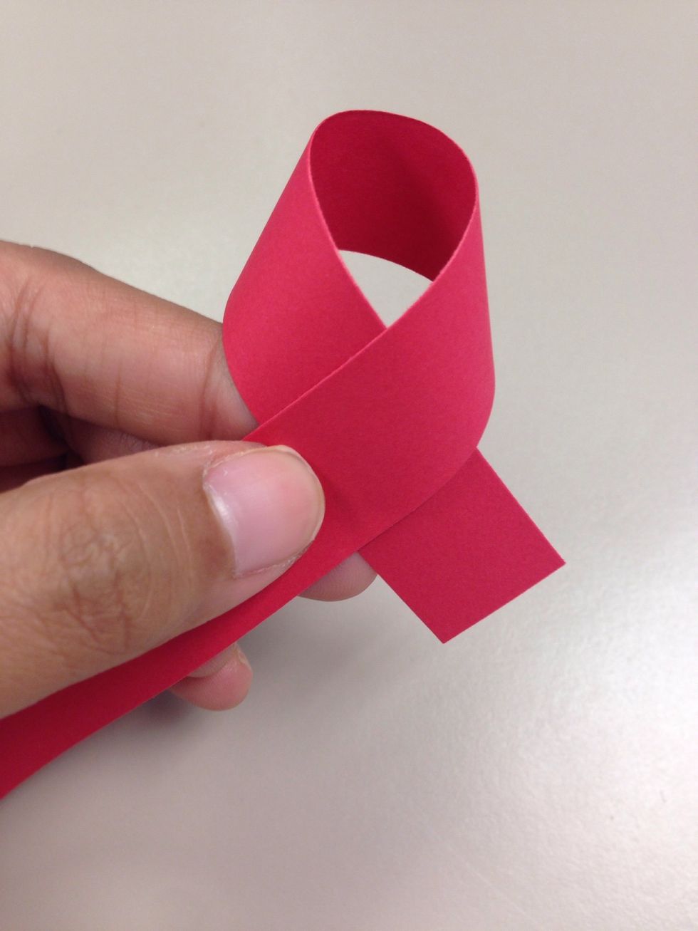 Try to make a knot with the strip as shown