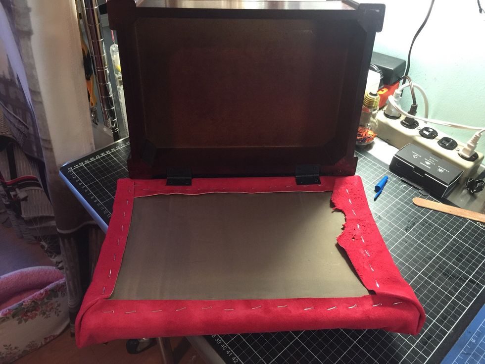 Try to staple near by each staple then screw the piece to the wood bench