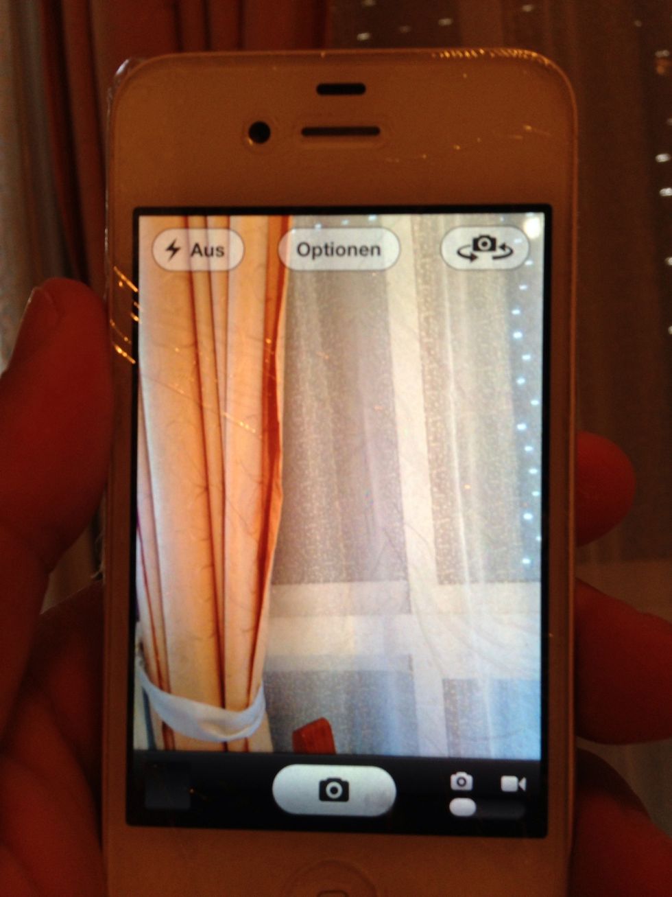 Try to take a picture and adjust the plastic wrap a bit.