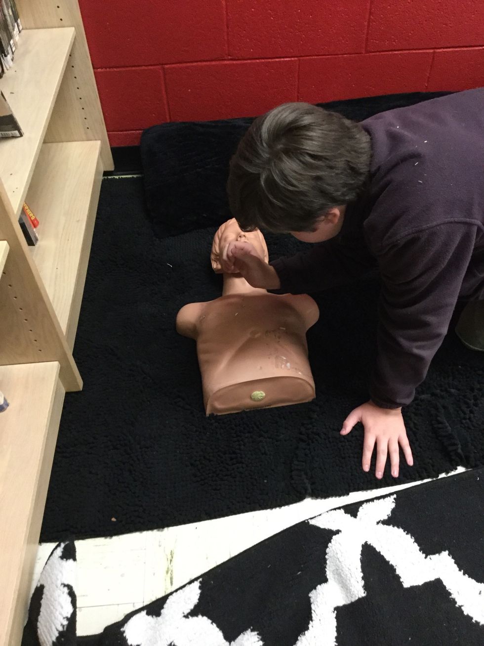 Try to to get a response from the person. If not proceed with CPR