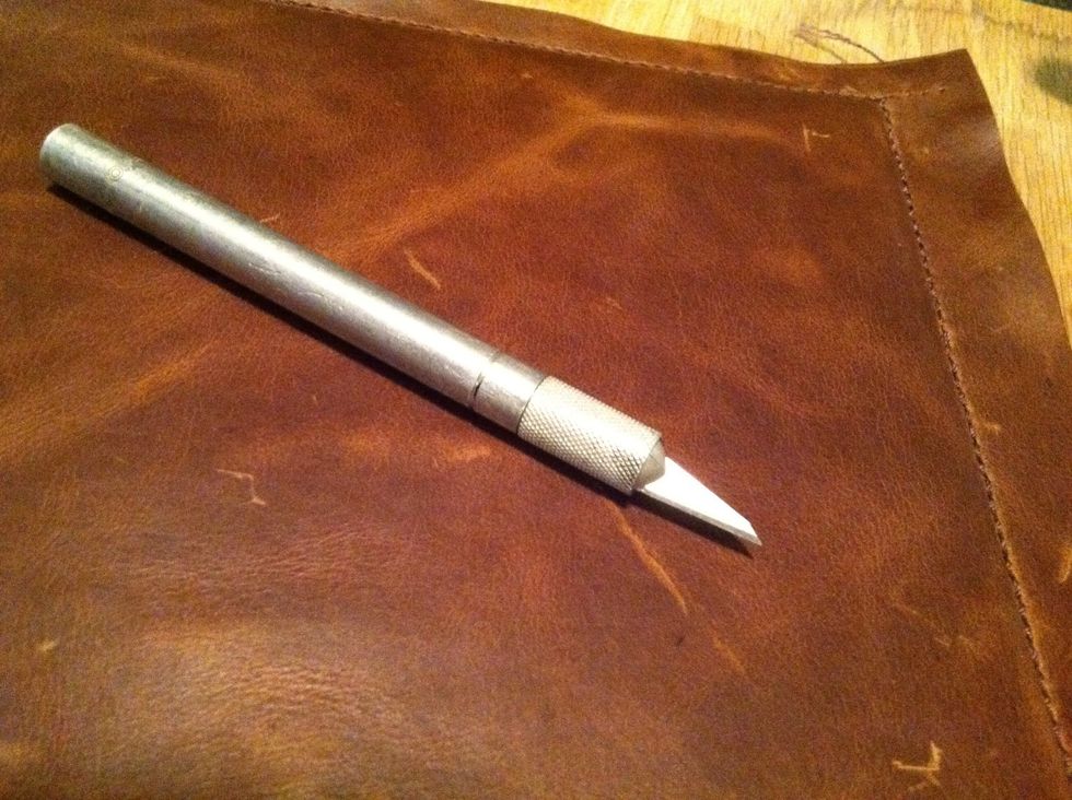 Try to use the sharpest knife you can, in this case, I'm using an Xacto knife with a NEW blade.