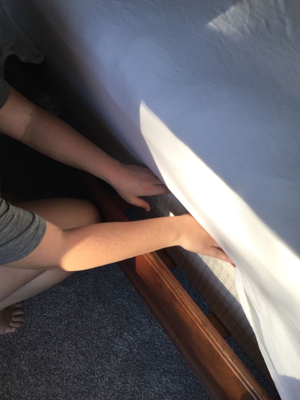 Tuck all sides of the flat sheet under the mattress EXCEPT at the head of the bed