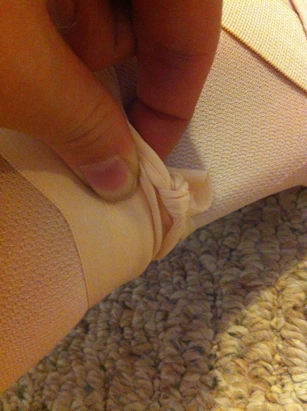 Tuck folded ribbons underneath from the bottom. This is so you won't have ribbons falling down, which is unprofessional and tacky.