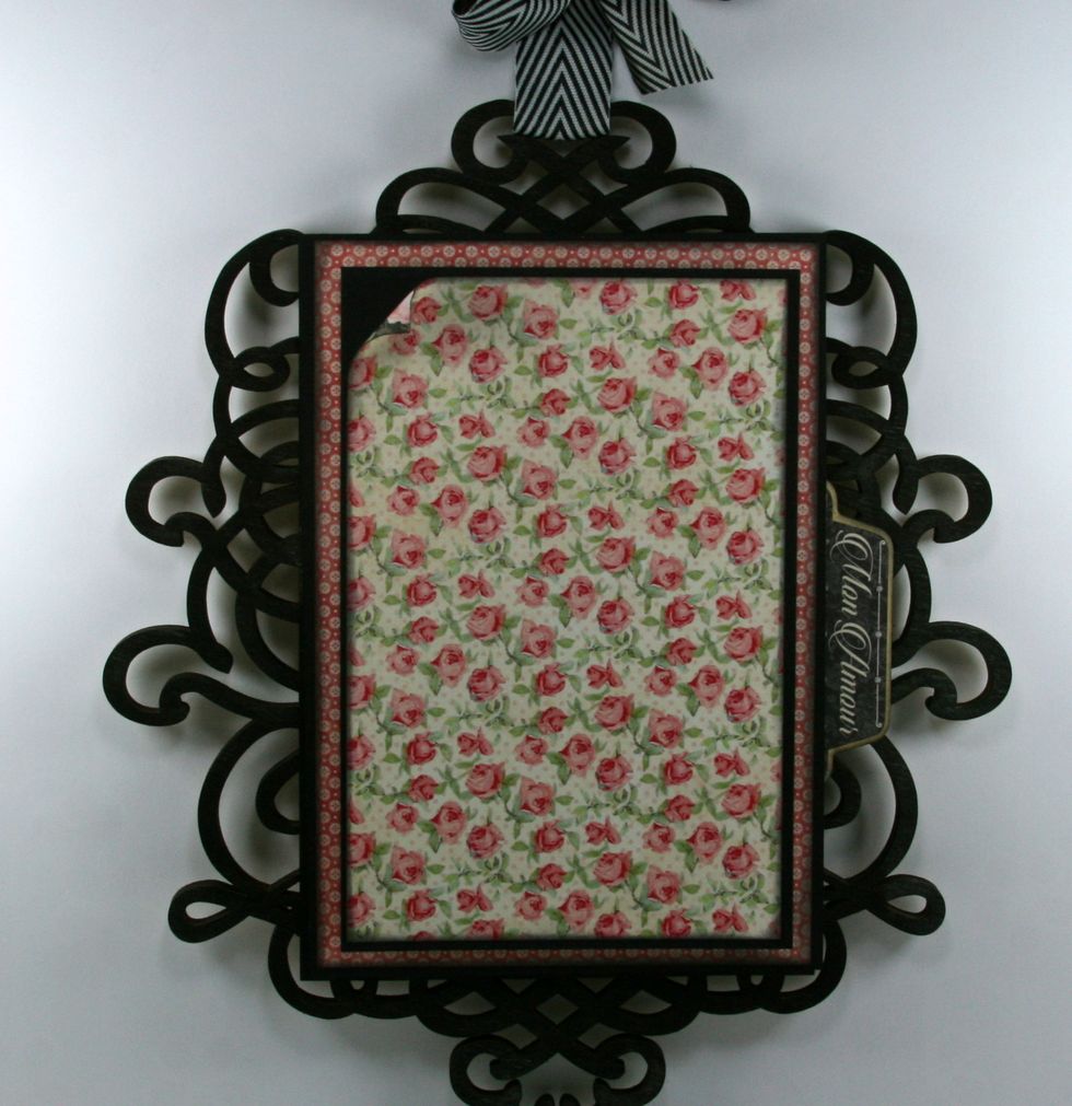 Tuck in chipboard tab just under the right side edge.