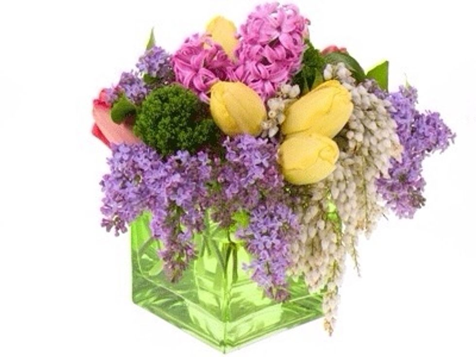 Tuck in the tulips and hyacinth in next, still using the grid group like blooms together for a more modern look. Make sure it is beautiful from all sides, and you are ready to enjoy!