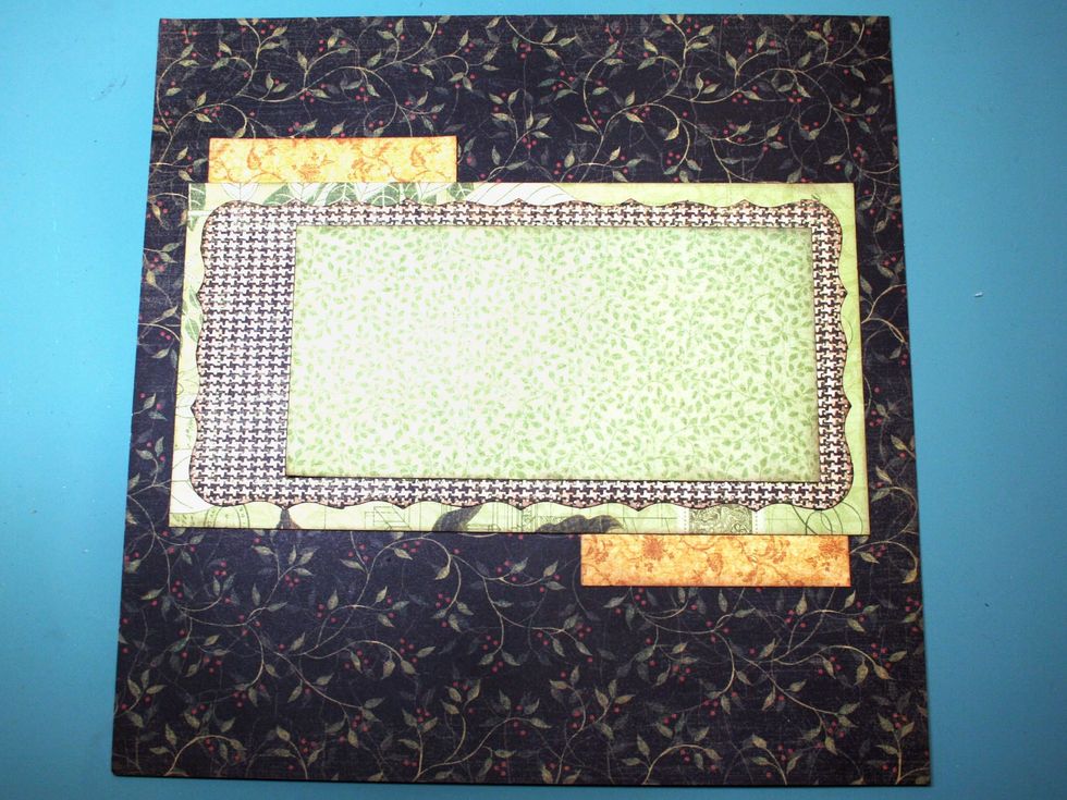 Tuck in the two gold scraps as shown, leaving about 3/4" visible.