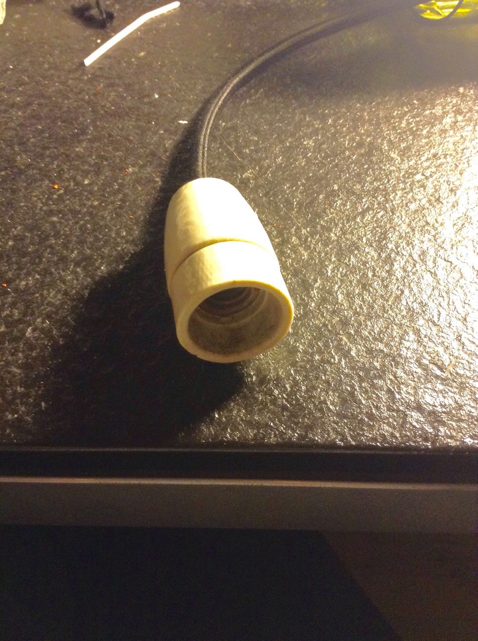 Tuck it in and screw the socket in place