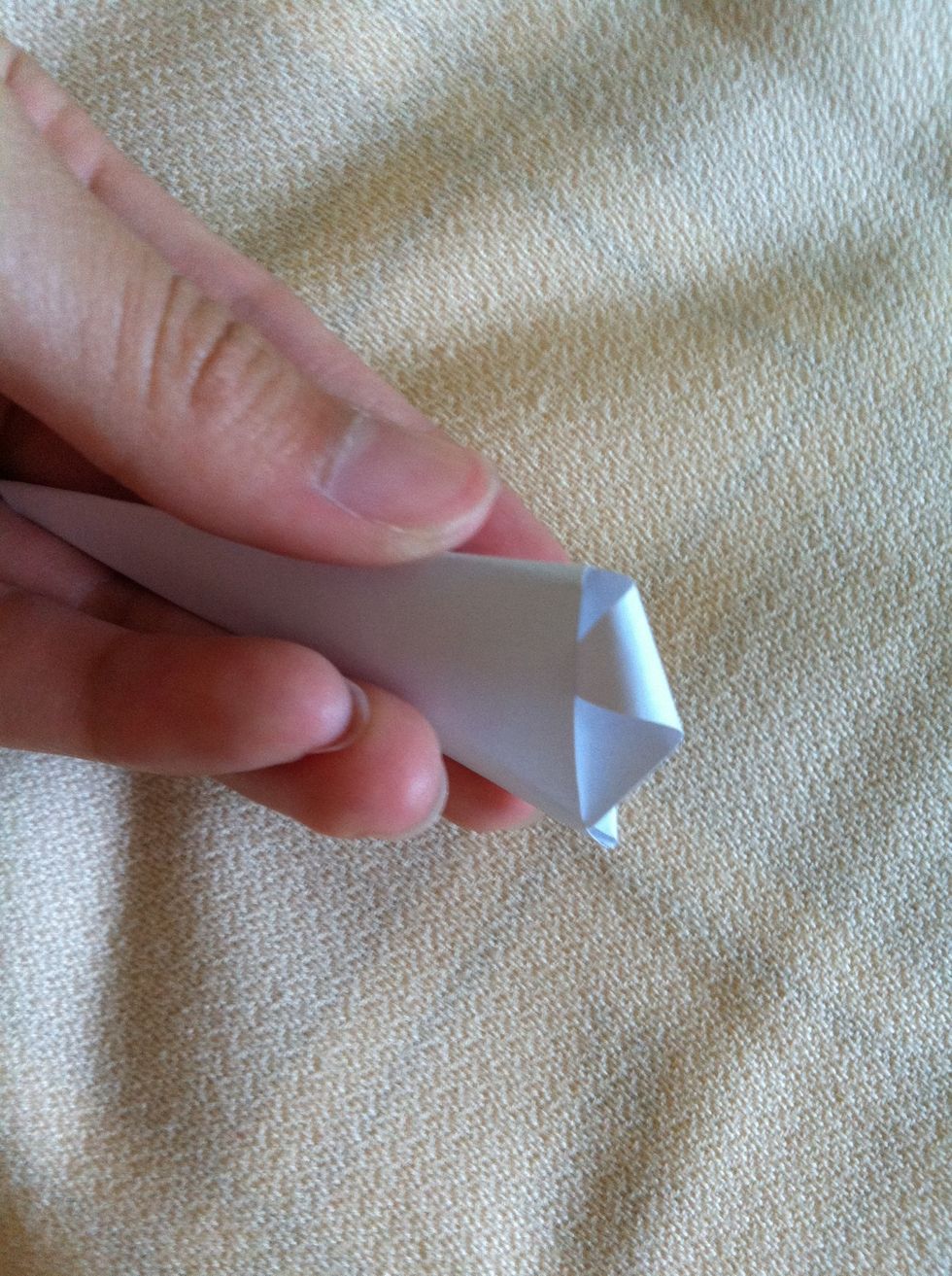 Tuck it in to the flap in front of that