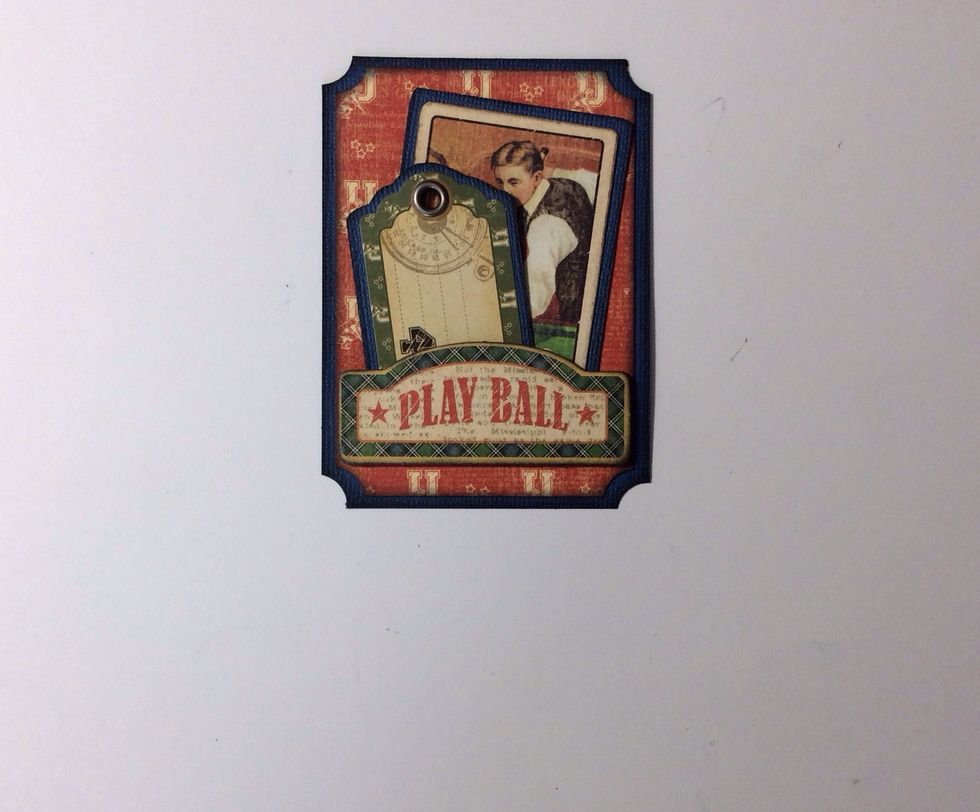 Tuck tag and card in to the pocket . Pocket two is now complete.
