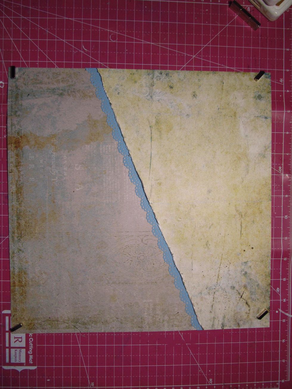 Tuck the border strip under the distressed edge of your patterned paper. You will need both strips to make it all the way across.