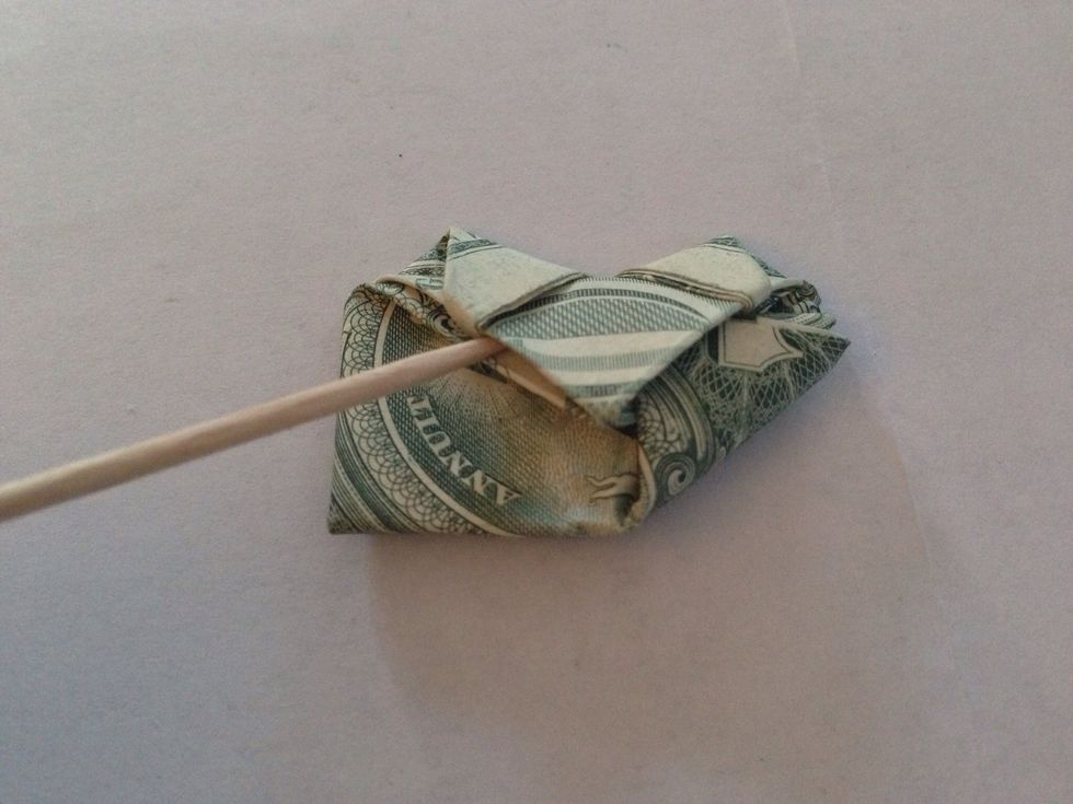 Tuck the corners into the slot again (slot shown where toothpick is). Do both corners & you're done.