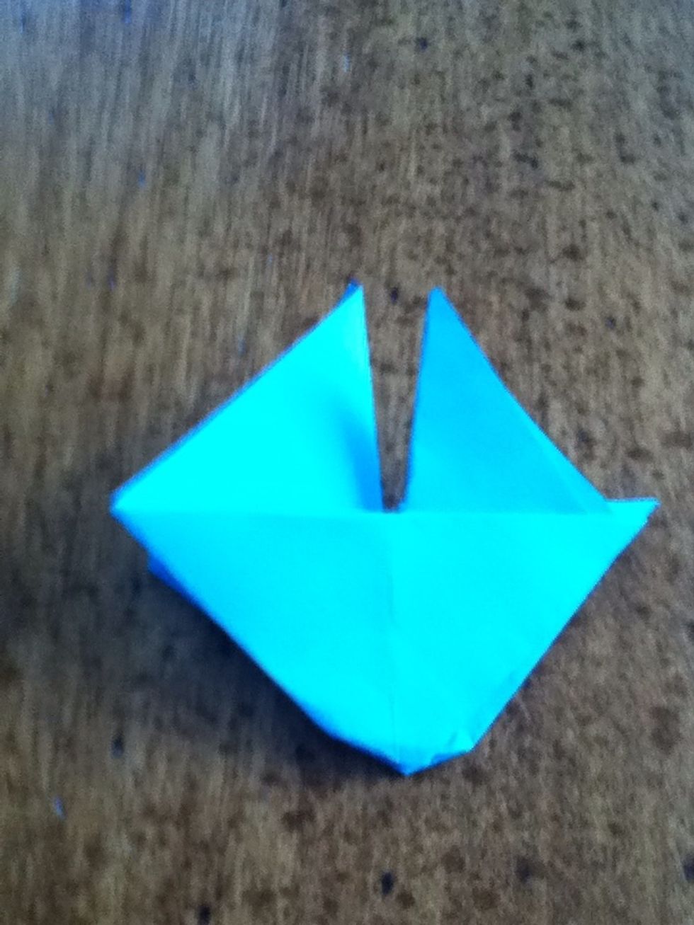Tuck the smaller sail into the hull to hide that ugly crease.
