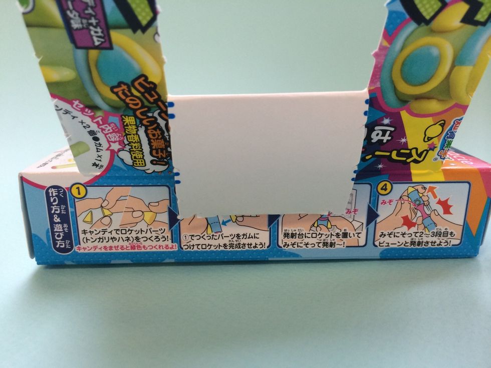 Tuck the tab under the back of box