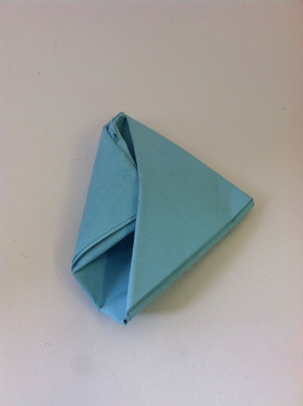 Tuck the thinner side into the pocket made by the thicker side.