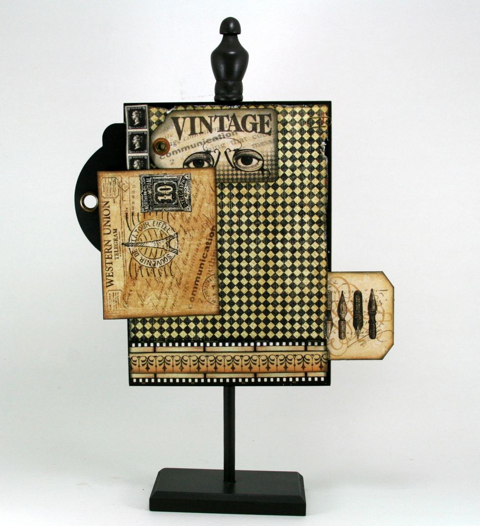 Tuck the vintage tag from Communique Tags just under the top right corner of postcard.