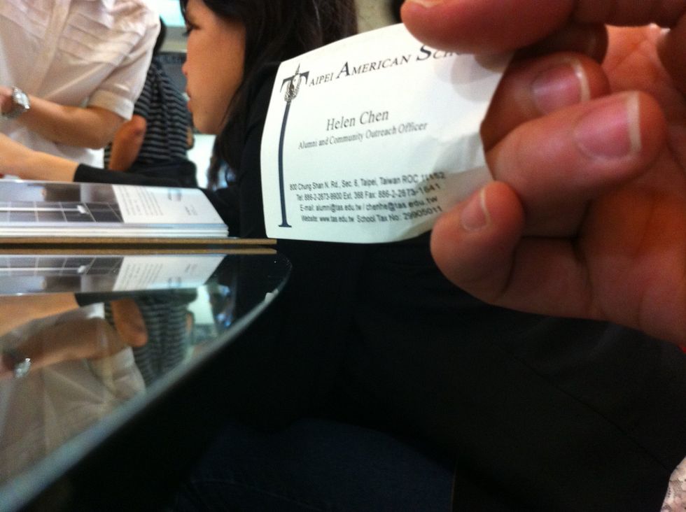 Tuck your middle and ring finger behind the card